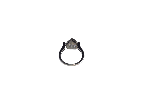 Sterling silver ring featuring pear-shaped setting with sparkling stones